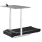 Adjustable standing desk with gray top and white frame mounted over black treadmill base with control panel