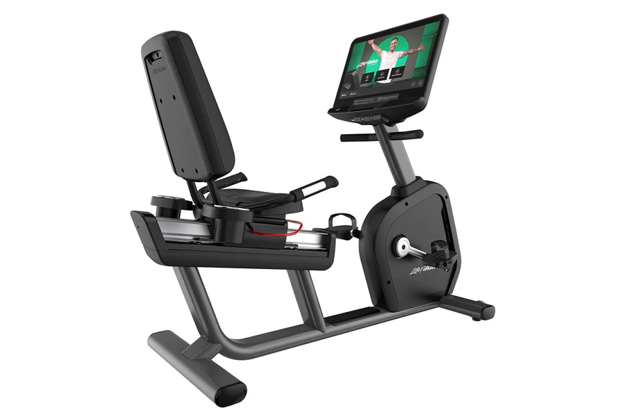 Black recumbent exercise bike with gray frame, padded seat, attached tablet displaying fitness content, and console controls