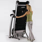 Woman in olive tank top using black and silver Life Fitness folding treadmill on white background