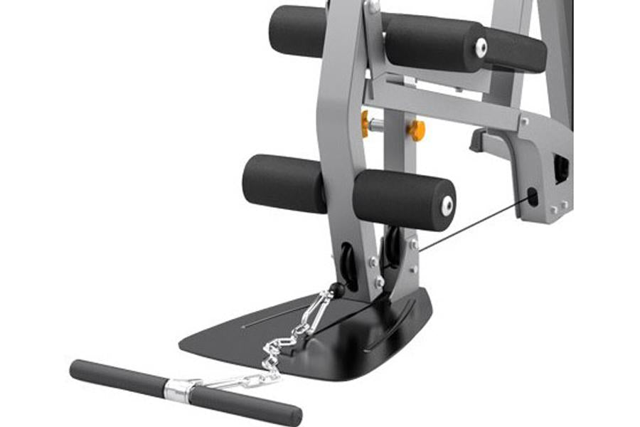 Gray and black home gym equipment with padded leg extension attachment, footplate, and dual handle bars on white background
