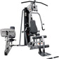 Life Fitness G4 home gym with silver frame, black padded seat, leg press attachment on left, and lat pulldown arms with black