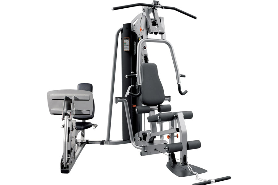Life Fitness G4 home gym with silver frame, black padded seat, leg press attachment on left, and lat pulldown arms with black