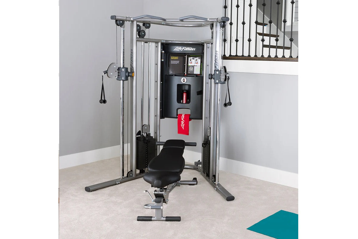 Life Fitness G7 home gym with silver frame, black center console, cable pulley system, and adjustable black seat in home gym 