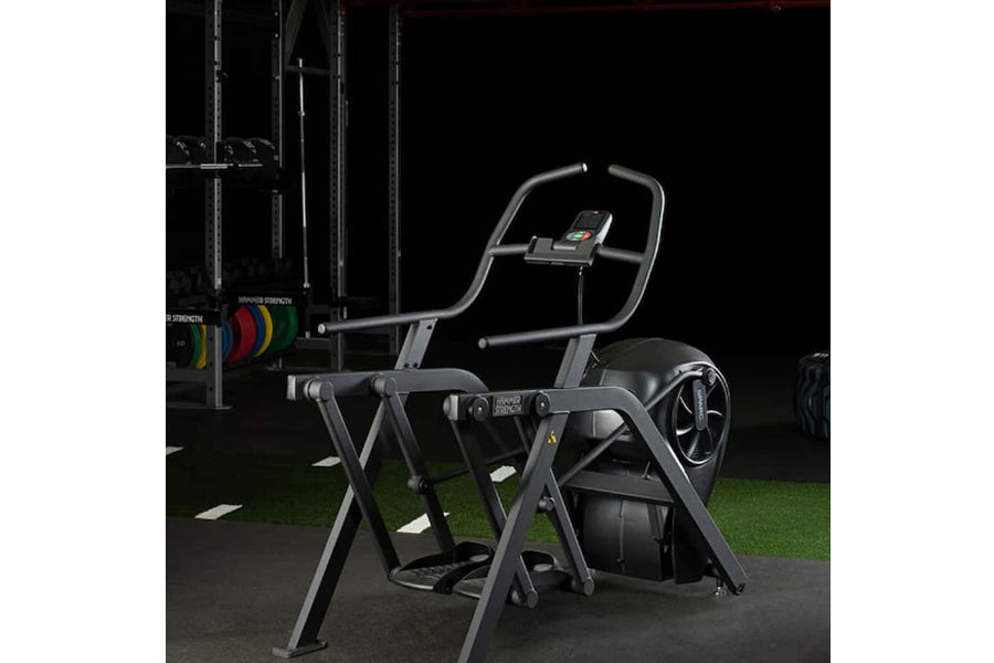 Life Fitness SPARC Arc Trainer Elliptical with gray frame, black seat and handles, digital console, in gym setting