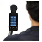 Black digital fitness monitor with touchscreen display showing workout metrics, mounted on rowing machine pole, held by perso