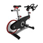 Indoor exercise bike with black and silver frame, red accented wheel, black seat, and handlebar display, shown at angle on wh