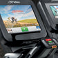 Life Fitness Platinum Club Series exercise machine with touchscreen display showing cycling workout scene and control console