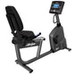 Life Fitness RS1 recumbent exercise bike with black padded seat, gray frame, digital console display, and foot pedals on whit