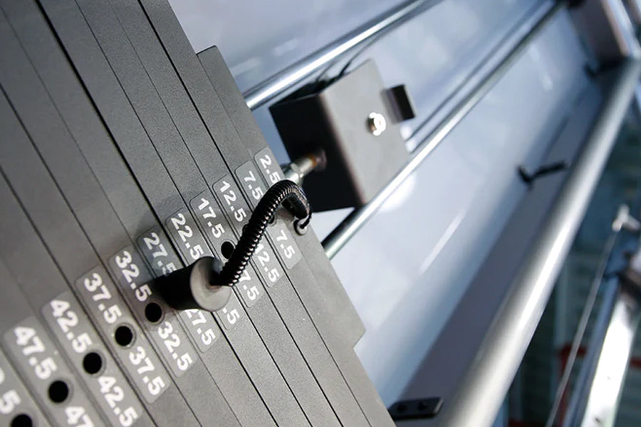 Life Fitness Signature Series dumbbells with numbered weight increments from 2.5 to 47.5 pounds, stacked in rack