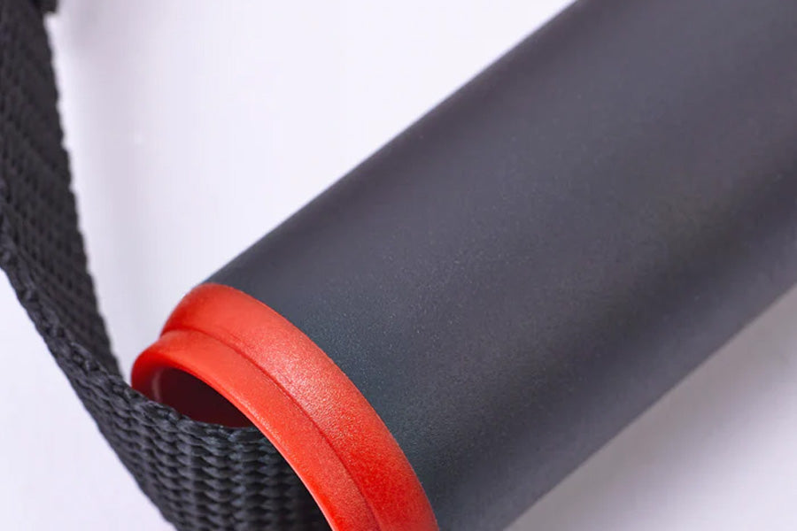 Lifeline Max Flex resistance band with red rubber grip handle and black mesh strap detail, flat lay on white background