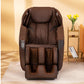 Brown leather zero gravity massage chair with padded headrest, armrests, and foot rest in living room setting