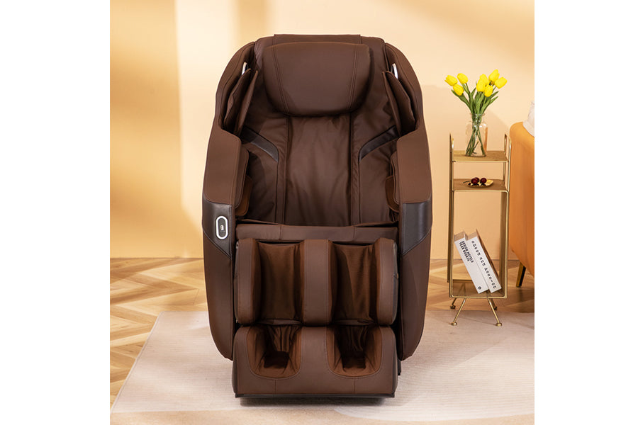 Brown leather zero gravity massage chair with padded headrest, armrests, and foot rest in living room setting
