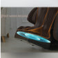 Brown leather massage chair with orange trim and illuminated blue foot airbag massage section, shown in zero gravity recline 