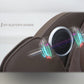 Brown leather massage chair with white and black speaker ring and colorful sound wave graphic overlay