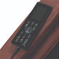 Black remote control with display screen and multiple buttons on brown leather massage chair