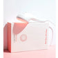 LightStim LED light therapy device with white and pink packaging labeled "For Wrinkles" and "Bye Bye Wrinkles" on pink backgr