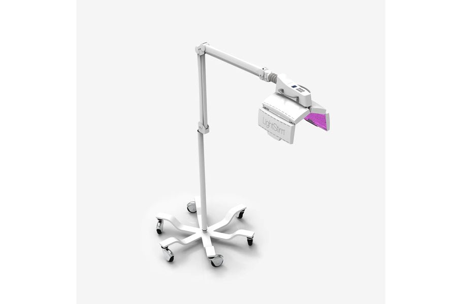 White rolling LED light therapy lamp with adjustable arm and purple light panel attachment on neutral background