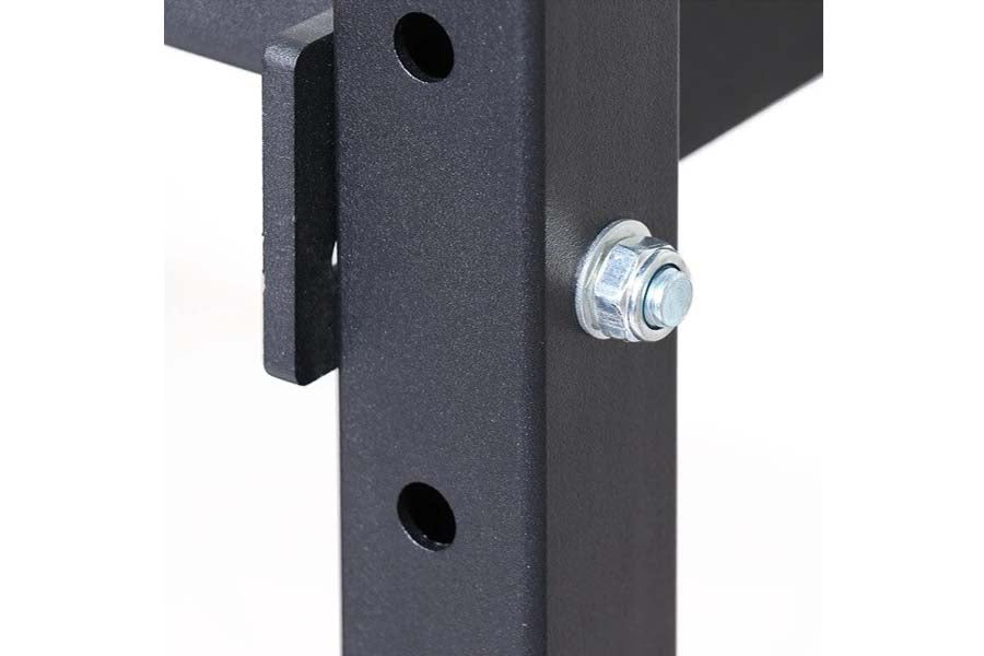 Dark gray steel weight rack post with chrome bolt attachment and mounting holes on white background