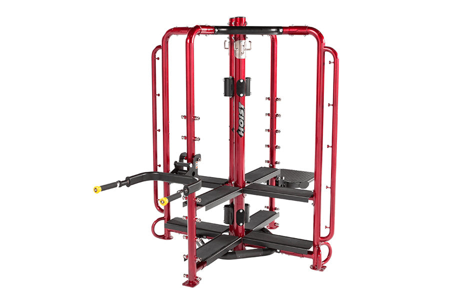 Red and black multi-station home gym with cable machines and weight stacks on white background