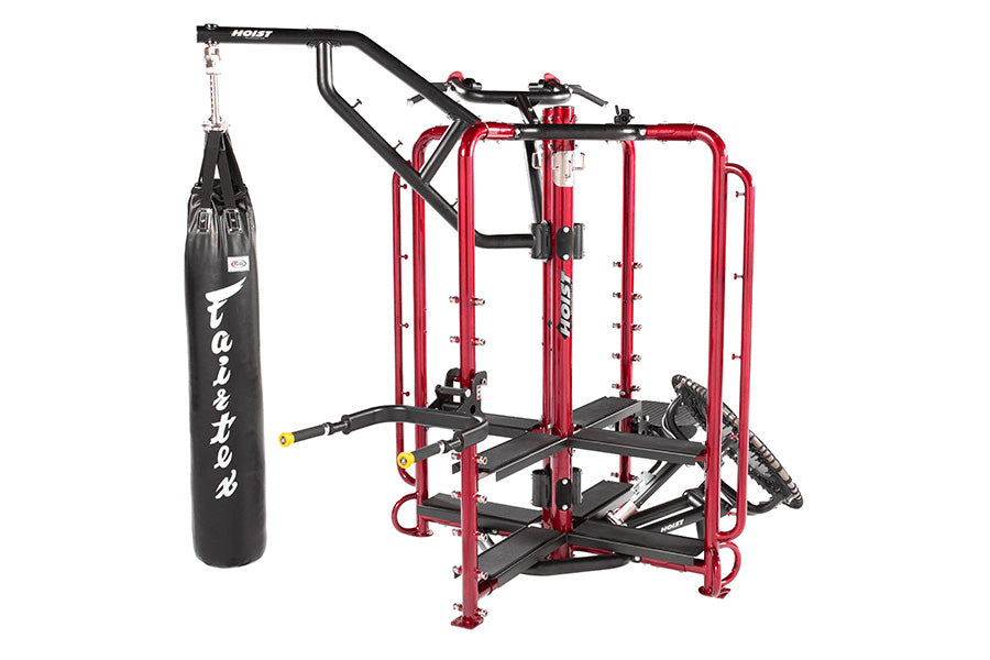 Hoist MCS-8002 Motioncage Studio Package 2 home gym with red frame, black components, and hanging heavy bag on white backgrou