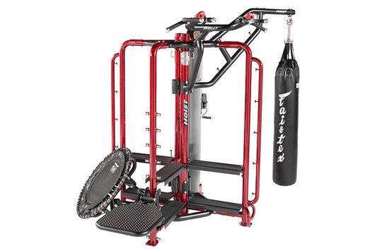Red and black multi-functional home gym cage with pull-up bar, adjustable arm machine, heavy bag attachment, and tire wheel o