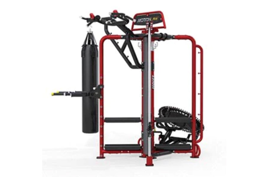 Red and black commercial multi-station gym equipment with punching bag, stationary bike, and treadmill attachments on white b