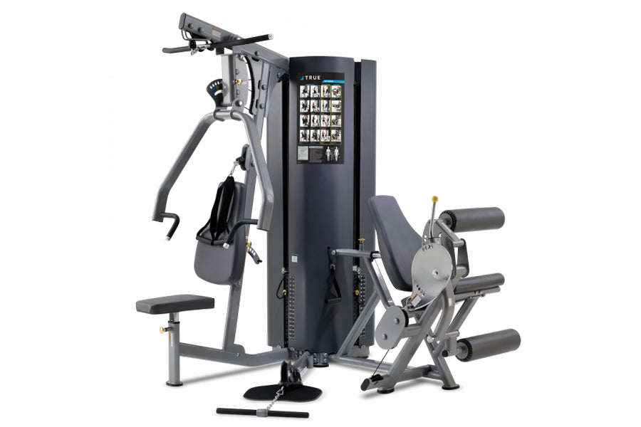 TRUE MP 2.0 multi-station gym machine with black frame, digital display, and multiple exercise attachments on white backgroun