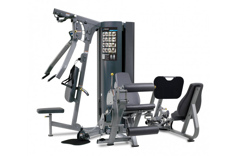 Multi-station exercise machine with gray metal frame, black padding, digital display panel, and various weighted resistance a