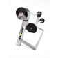 MX80 white and black adjustable barbell system with rapid change mechanism, dumbbells, and curl bar on white background