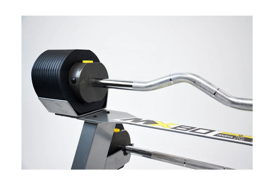 MX80 rapid change barbell system with black weight plates on gray stand, silver curl bar, and yellow accents on white backgro