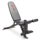 Marcy Deluxe Utility Weight Bench with gray padded seat, black metal frame, and leg extension attachment on white background
