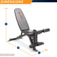 Marcy deluxe utility weight bench with gray padded seat back, black metal frame, and adjustable leg extension, shown with dim