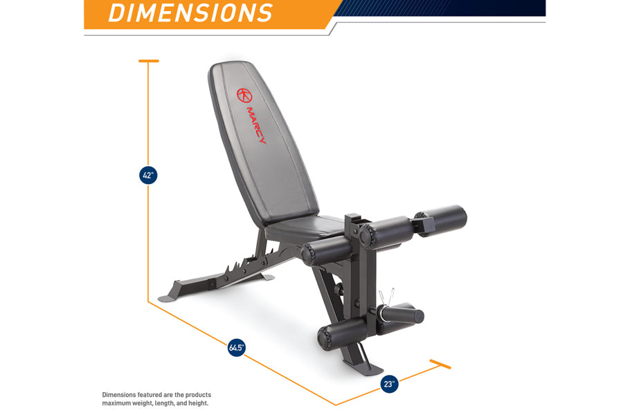 Marcy deluxe utility weight bench with gray padded seat back, black metal frame, and adjustable leg extension, shown with dim