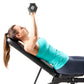 Woman in turquoise tank top performing dumbbell chest press on black Marcy utility weight bench