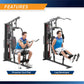 Man using Marcy home gym machine demonstrating preacher curl pad and leg developer exercises on white background