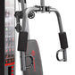 Marcy 150lb stack weight home gym with silver metal frame, black foam handles, and gray padded seat with red accents, on whit