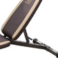 Marcy adjustable weight bench with black and tan padded seat back, black metal frame, angled view on white background