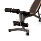 Black and tan weight bench with leg extension and curl attachment on white background