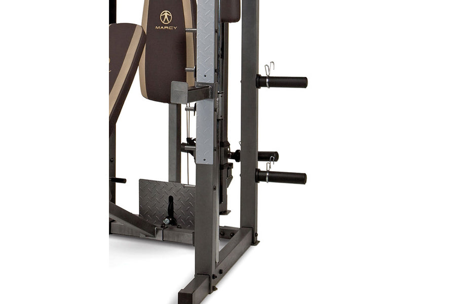 Marcy Smith Machine Home Gym with brown padded seat, gray steel frame, black handles, and diamond plate footrest on white bac