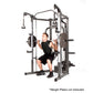 Marcy Smith Machine home gym with gray steel frame, weight plate posts, and cable attachments, demonstrating squat position w