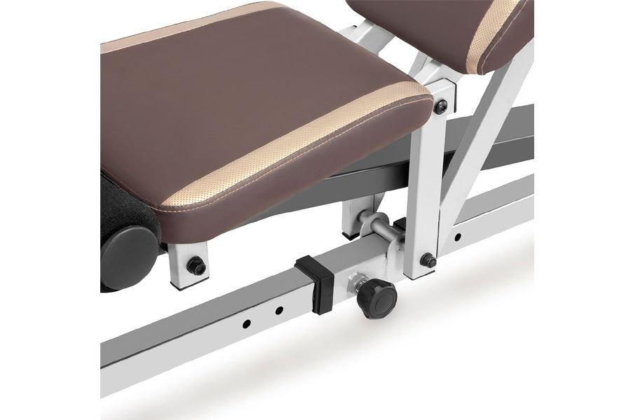 Marcy Smith Machine with brown padded seat and backrest, white metal frame, adjustable footrest and leg extension lever on wh