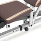 Brown and tan padded weight bench with white metal frame and adjustable footrest, detail view