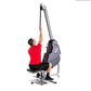 Man in red shirt using gray and black Marpo VLT Compact Rope Trainer, pulling rope upward in seated position on white backgro