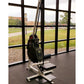 Marpo VLT Compact Rope Trainer with black resistance bag and white frame in gym setting near windows overlooking sports field