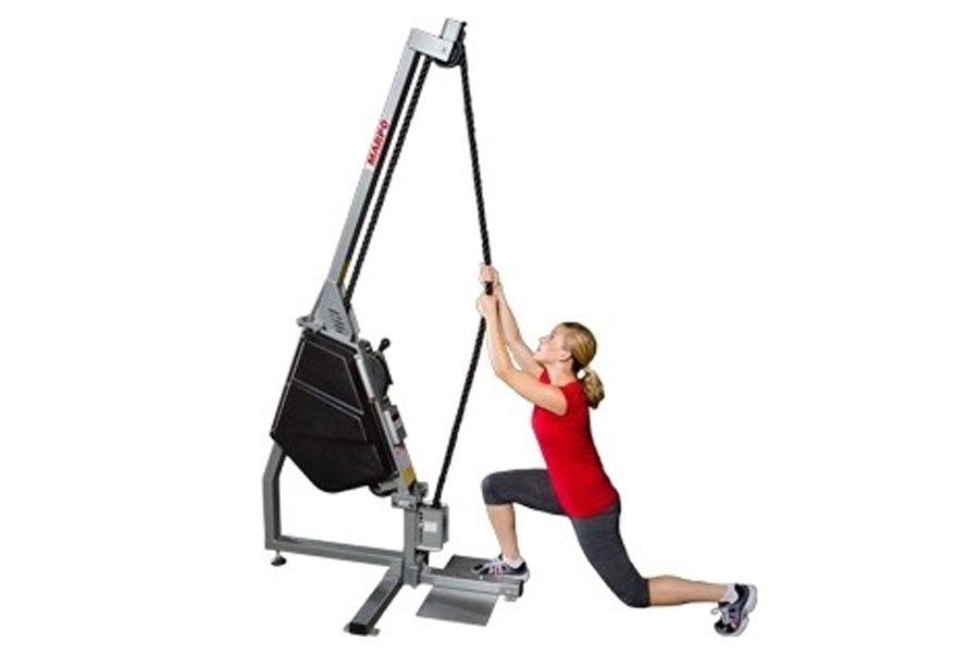 Woman in red tank top using gray and black cable training machine with rope attachment on white background