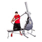 Male athlete in red shirt using gray and blue Marpo VMX 360 rope trainer with adjustable arm on white background