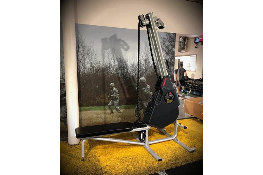 Marpo VMX 360 black and silver rope trainer with overhead crane arm and adjustable rope system, displayed in showroom setting