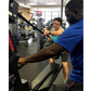 Personal trainer in blue shirt guiding man on Marpo VMX 360 rope trainer machine in gym setting