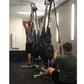 Two people using Marpo VMX rope trainer machine with dual handles in gym setting