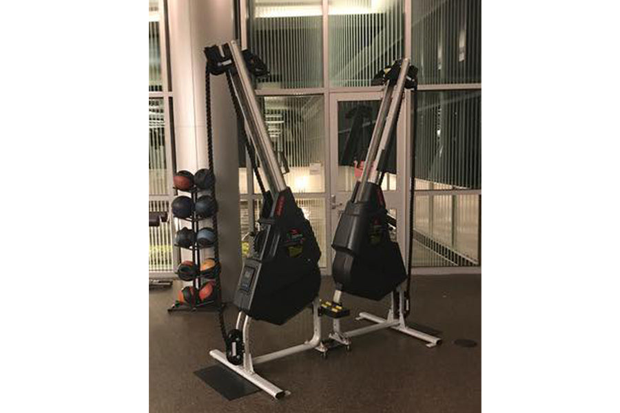 Marpo VMX rope trainer with dual black heavy bags mounted on white stand frame in gym setting
